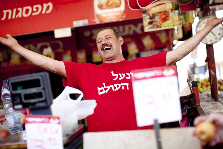 Market seller, Tel Aviv, Israel by Adam Gasson