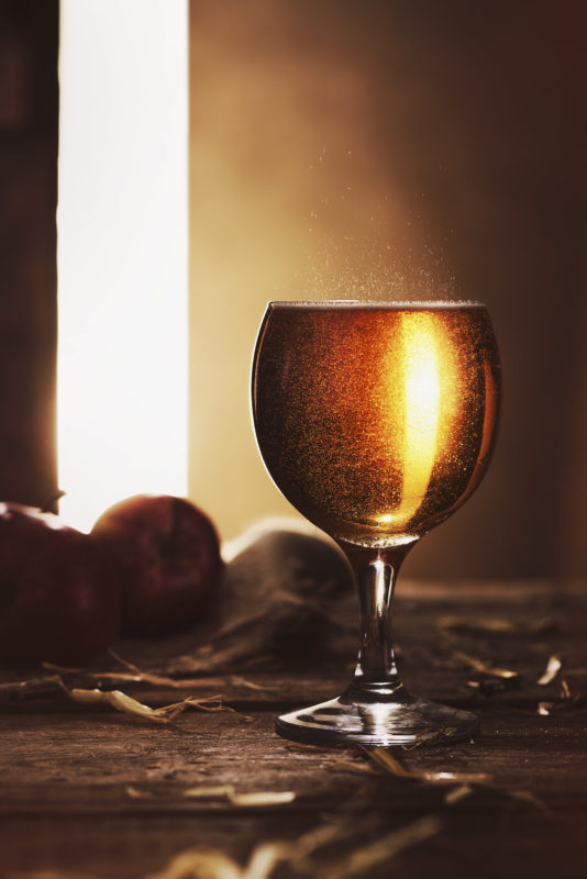 Glass of Pilton cider photographed in a photography studio in Bristol