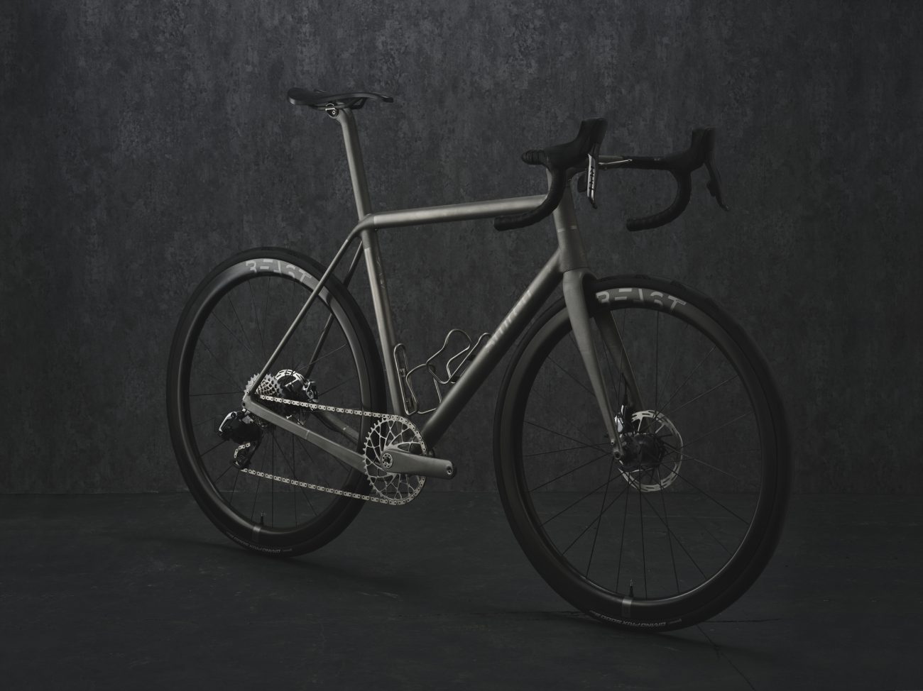 Studio photograph of a Sturdy Cycles 3D printed titanium road bike