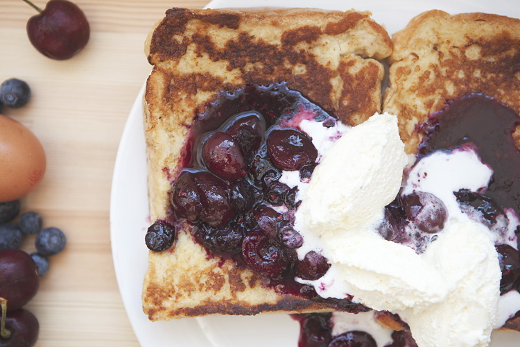 French toast with fruit compote and whipped cream breakfast by Adam Gasson