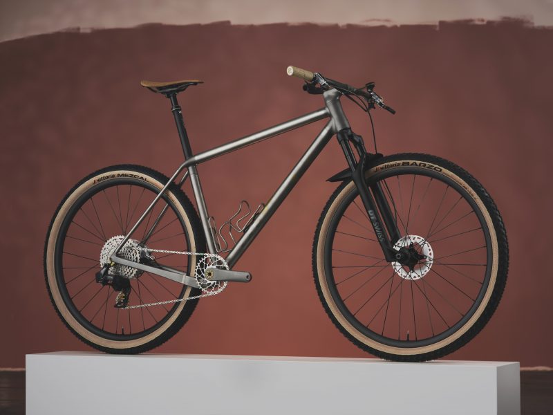 Studio photograph of a Study Cycles titanium 3D printed mountain bike