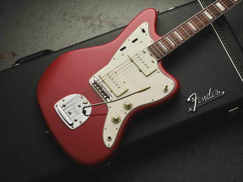 Studio photograph of a red Fender American Vintage II Jazzmaster